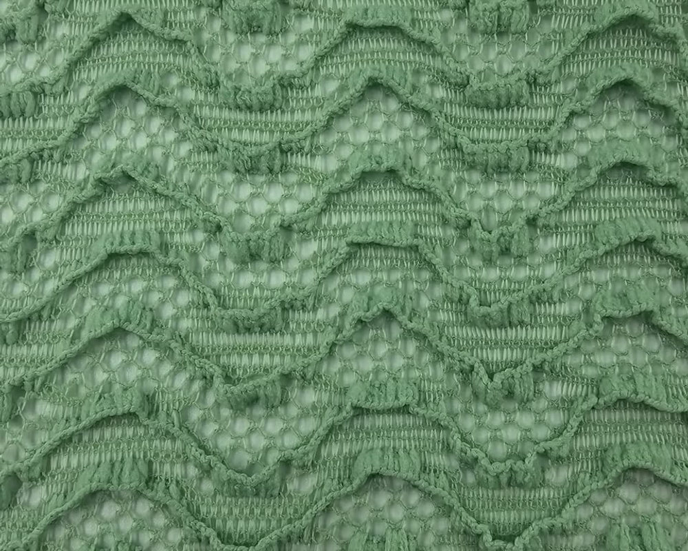 Punto jacquard ondas calado verde